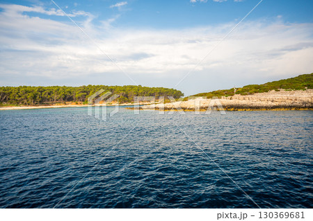 Uninhabited islands of the Lastovo National Park surrounded by calm sea in Croatia. Nature reserve, remote landscape and Mediterranean summer escape 130369681