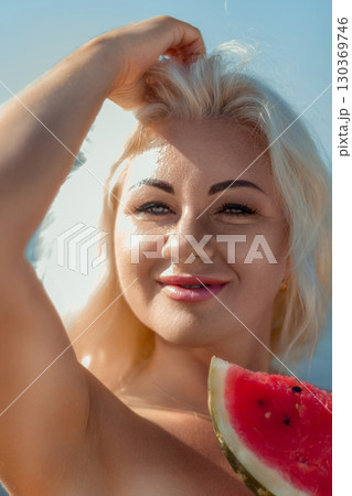 Woman Watermelon Summer Beach Portrait: Happy blonde enjoys sunny day, holding watermelon slice outdoors. 130369746