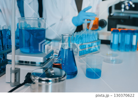 Collaboration, tablet or science with people in lab together for research or development. Innovation, tech and microscope with scientist team in clinical trial for planning or medical investigation Collaboration, tablet or science with people in lab together for research or development. Innovation, tech and microscope with scientist team in clinical trial for planning or medical investigation 130370622