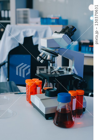 Collaboration, tablet or science with people in lab together for research or development. Innovation, tech and microscope with scientist team in clinical trial for planning or medical investigation 130370631