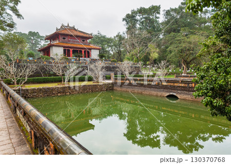 Pavilion at Minh Mang Tomb reflected in a pond, Hue, Vietnam 130370768