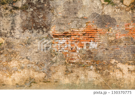 Weathered palace wall with exposed brickwork in Hue Imperial City Vietnam 130370775