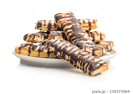 Sfogliatine glassate with chocolate. Italian crispy dessert isolated on white background. Sfogliatine glassate with chocolate. Italian crispy dessert isolated on white background. 130373064
