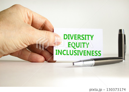 DEI diversity equity inclusiveness symbol. Concept words Diversity Equity Inclusiveness on white card. Beautiful white background. Business DEI diversity equity inclusiveness concept. Copy space. 130373174