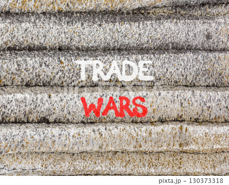 Trade wars symbol. Concept word Trade wars on beautiful grey mountain wall. Beautiful grey mountain wall background. Business trade wars concept. Copy space. 130373318