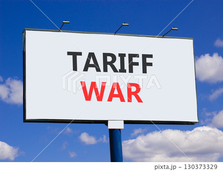 Trade tariff war symbol. Concept word Tariff war on beautiful white billboard. Beautiful blue sky and clouds background. Business trade tariff wars concept. Copy space. 130373329