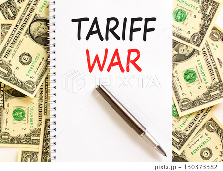 Trade tariff war symbol. Concept word Tariff war on beautiful white note. Dollar bills. Beautiful dollar bills background. Black pen. Business trade tariff wars concept. Copy space. 130373382