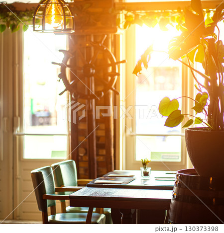 Natural restaurant interior with scenic view at sunset Natural restaurant interior with scenic view at sunset 130373398