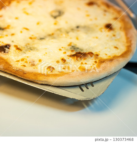 real Neapolitan Italian pizza called margherita pizza just out of the oven 130373468