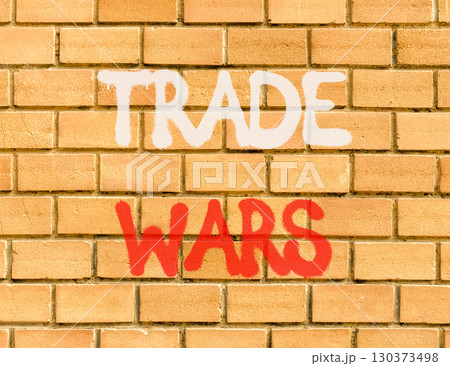 Trade wars symbol. Concept word Trade wars on beautiful brown brick wall. Beautiful brown brick wall background. Brick wall. Business trade wars concept. Copy space. 130373498