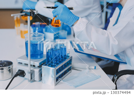 Collaboration, tablet or science with people in lab together for research or development. Innovation, tech and microscope with scientist team in clinical trial for planning or medical investigation Collaboration, tablet or science with people in lab together for research or development. Innovation, tech and microscope with scientist team in clinical trial for planning or medical investigation 130374494