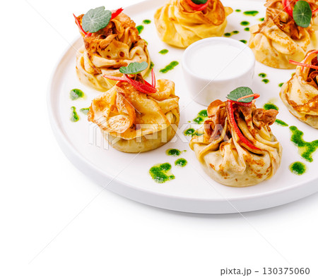 Gourmet dish served stylishly at a fine dining restaurant 130375060
