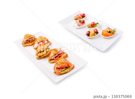Delicious appetizers with croissants and fresh fruit served elegantly 130375069