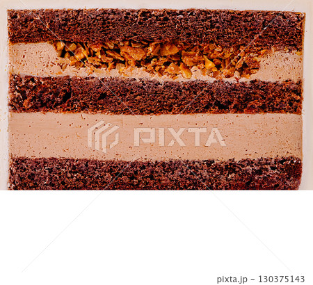 Delicious layered chocolate cake with crunchy filling and creamy texture Delicious layered chocolate cake with crunchy filling and creamy texture 130375143