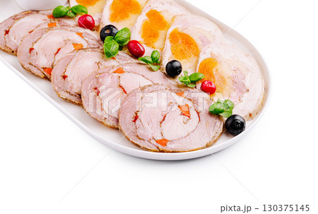 Culinary platter featuring savory rolled meats with colorful garnishes Culinary platter featuring savory rolled meats with colorful garnishes 130375145