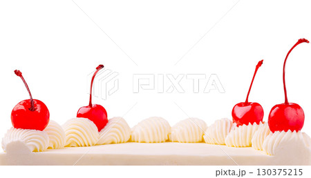 Whipped cream and cherries decorate a dessert with elegance 130375215