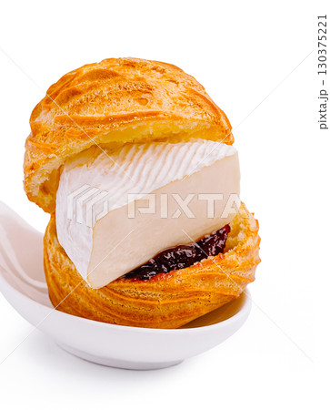 Creative dessert featuring puff pastry with cream and fruit jam 130375221
