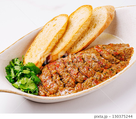 Eggplant caviar with toast and fresh cilantro close up Eggplant caviar with toast and fresh cilantro close up 130375244