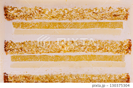 Delicate layers of citrus jelly on a white plate with a textured background Delicate layers of citrus jelly on a white plate with a textured background 130375304