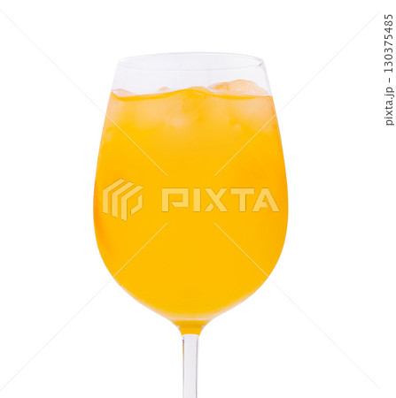 Bright citrus drink in a glass filled with ice for a refreshing experience Bright citrus drink in a glass filled with ice for a refreshing experience 130375485
