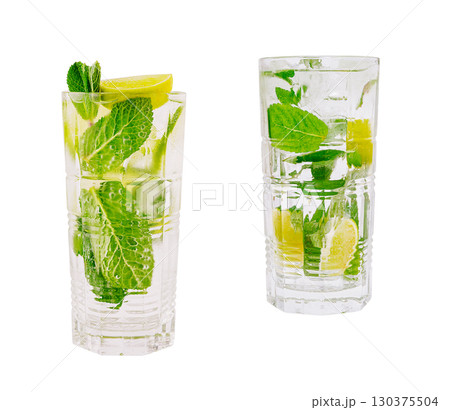 Refreshing mint and lime cocktails served in tall glasses 130375504