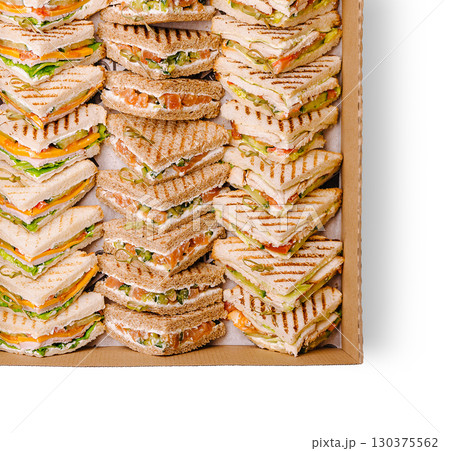 Delicious assortment of sandwiches prepared for a gathering or event Delicious assortment of sandwiches prepared for a gathering or event 130375562