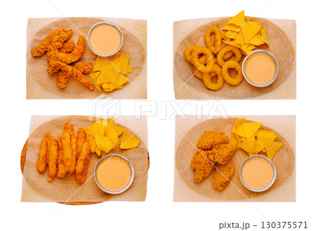 Tasty platter of fried snacks with dipping sauces at a casual eatery Tasty platter of fried snacks with dipping sauces at a casual eatery 130375571