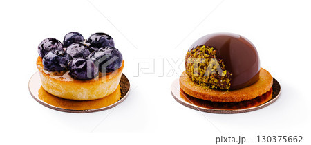 Rich dessert tarts with blueberries and chocolate on a clean white background Rich dessert tarts with blueberries and chocolate on a clean white background 130375662