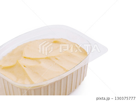 Plastic container with mayonnaise sauce isolated on white 130375777