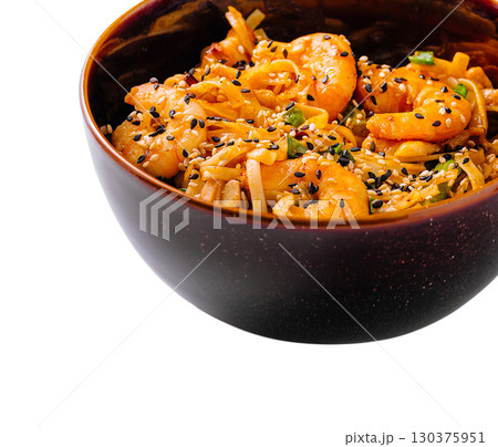 Delicious shrimp and noodle dish in a dark bowl with sesame seeds 130375951