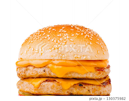Juicy chicken burger with melted cheese on a sesame seed bun Juicy chicken burger with melted cheese on a sesame seed bun 130375982