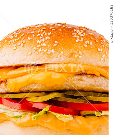 Juicy chicken burger with melted cheese and fresh toppings served on sesame bun Juicy chicken burger with melted cheese and fresh toppings served on sesame bun 130376165