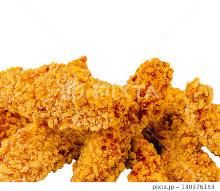 Crispy fried chicken tenders stacked on a white background Crispy fried chicken tenders stacked on a white background 130376183