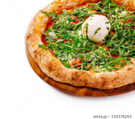 Delicious pizza topped with fresh arugula and creamy mozzarella 130376263