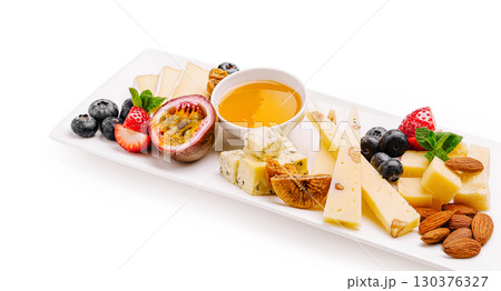 Delicious cheese platter with fruits and nuts perfect for any occasion 130376327