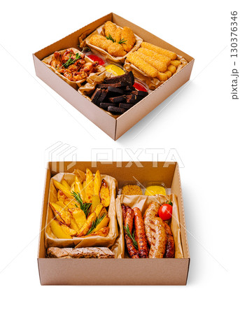 Flavorful assorted food platter featuring diverse dishes in takeout box 130376346