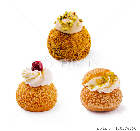 Delicious cream-filled pastries displayed on a clean white background 130376350