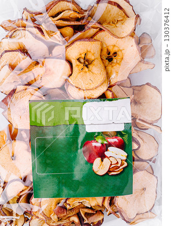 Dried apple slices packaged for easy snacking in a clear bag Dried apple slices packaged for easy snacking in a clear bag 130376412