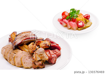Delicious assortment of grilled meats and fresh vibrant salad on display Delicious assortment of grilled meats and fresh vibrant salad on display 130376469
