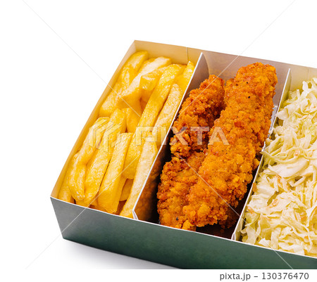 Crispy chicken tenders, golden fries, and fresh coleslaw in takeout box Crispy chicken tenders, golden fries, and fresh coleslaw in takeout box 130376470