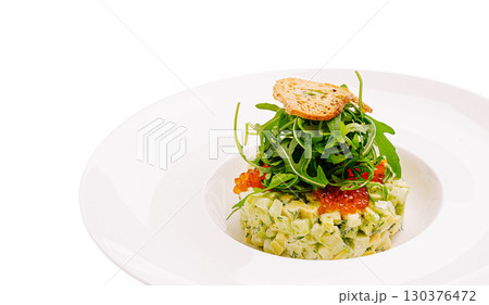 Delicate vegetable tartare featuring fresh greens and garnishes Delicate vegetable tartare featuring fresh greens and garnishes 130376472