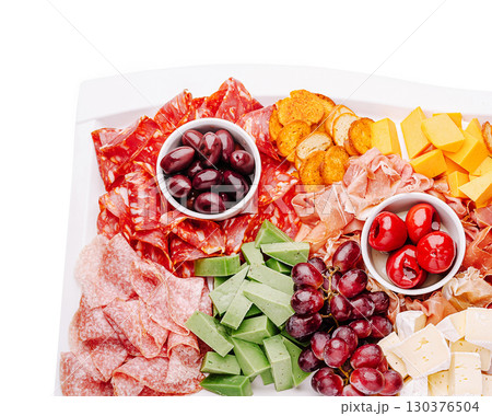 Assorted cheese and charcuterie platter with fresh fruits and olives Assorted cheese and charcuterie platter with fresh fruits and olives 130376504