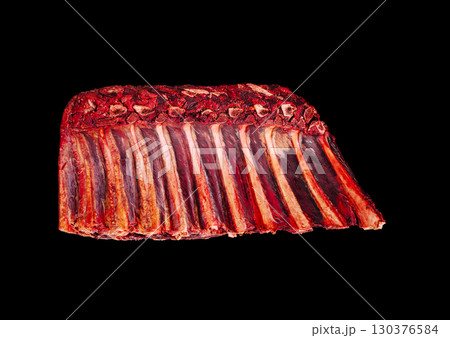 Prime rib roast showcased against a dark backdrop for presentation 130376584