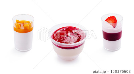 Delightful dessert trio featuring fruity panna cotta and vibrant toppings 130376608