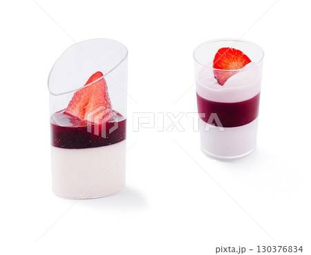 Delicious layered desserts with fresh strawberries and fruit sauce 130376834