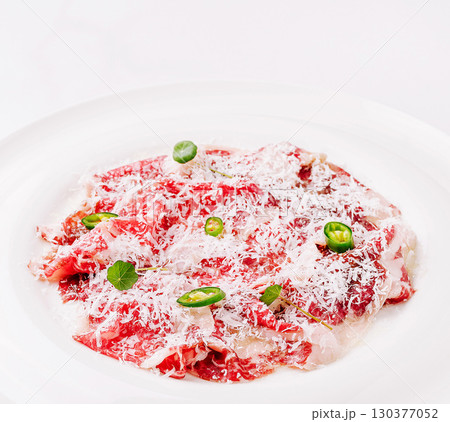 Deliciously prepared beef dish garnished with herbs and spices 130377052