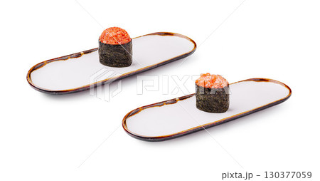 Exquisite sushi rolls presented on elegant plates in a minimal setting Exquisite sushi rolls presented on elegant plates in a minimal setting 130377059