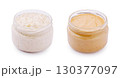 Creamy nut butter in a clear jar on a white background perfect f 130377097