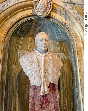 VATICAN CITY, ROME, ITALY - AUGUST 02, 2025 detailed white marble bust of Pope Pius XI, wearing intricate robes with detailed carvings of floral and leaf patterns VATICAN CITY, ROME, ITALY - AUGUST 02, 2025 detailed white marble bust of Pope Pius XI, wearing intricate robes with detailed carvings of floral and leaf patterns 130379803