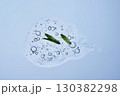 A drop of shampoo with bubbles. A texture with a leaf in it. 130382298
